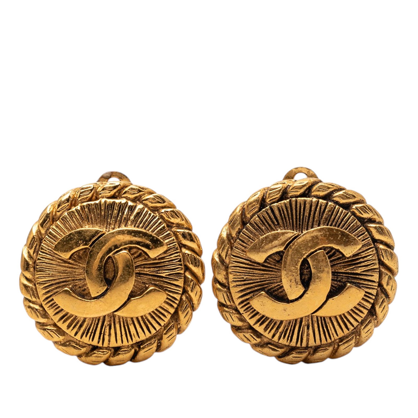 Chanel gold tone sunburst round clip earrings: Chanel gold tone sunburst round clip earrings These Chanel CC Sunburst round earrings feature a gold tone metal body with a classic clip-on closure. Made in France, these costume earrings display the 