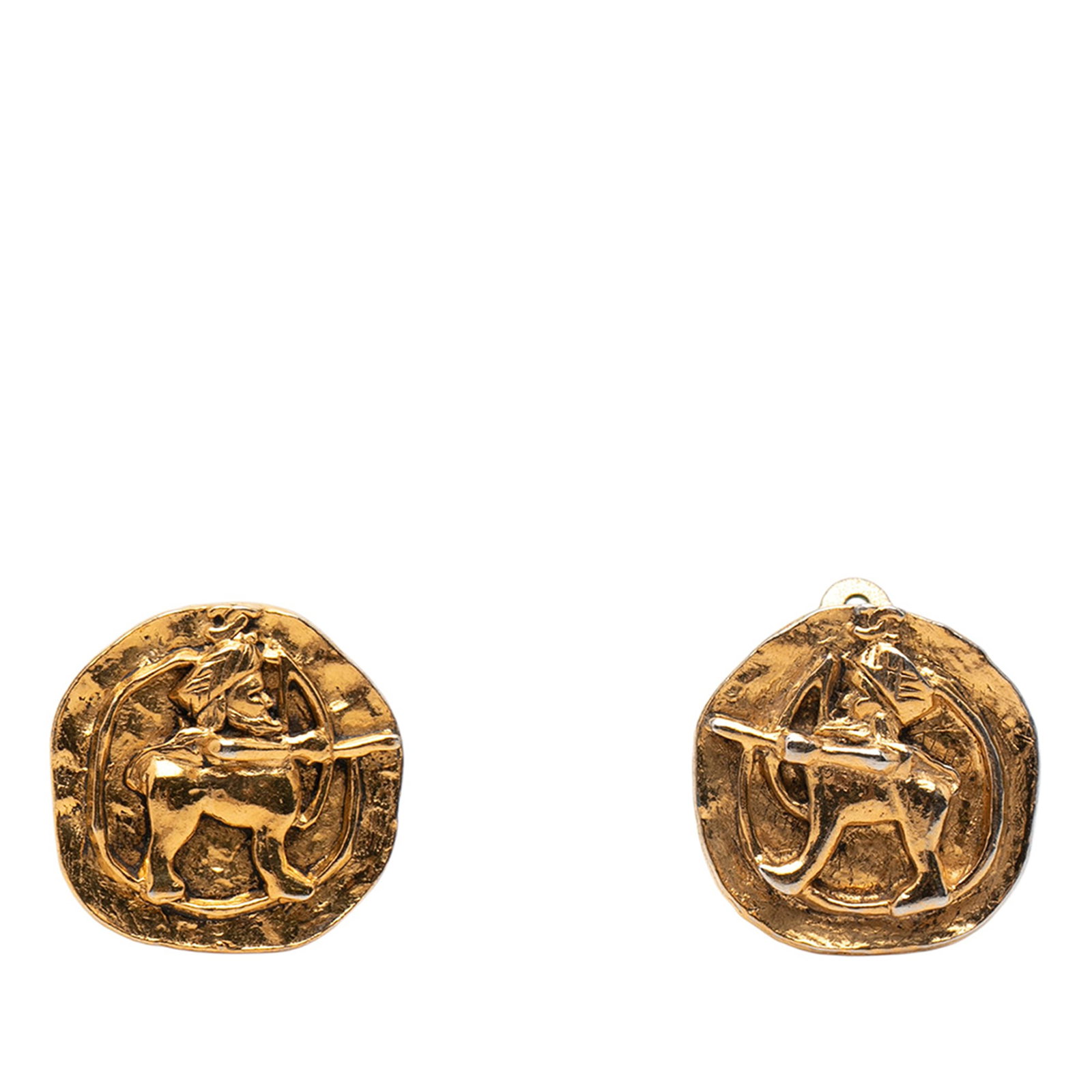 Chanel gold tone medallion clip on earrings: Chanel gold tone medallion clip on earrings These Chanel clip-on earrings feature gold tone metal bodies with an archer medallion design. Made in France, they are classified as costume jewelry and hav