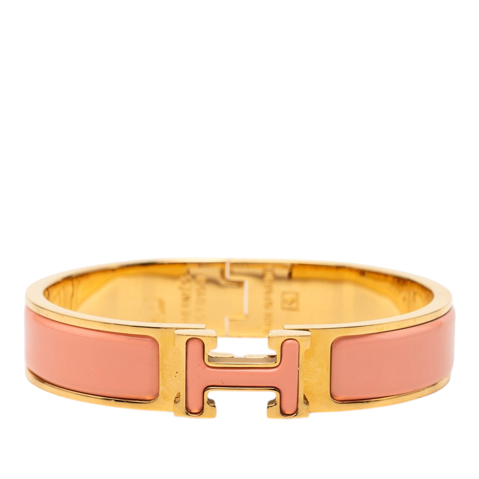 Hermes Pink Enamel Clic H PM Bracelet: Hermes Pink Enamel Clic H PM Bracelet This Hermes Narrow Enamel Clic H Bracelet PM features a pink enamel and gold-tone metal construction with a secure metal clasp closure. The bracelet is classified