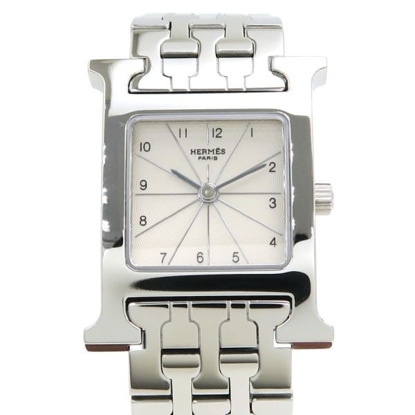 Hermes HH1.210 stainless steel quartz wristwatch: Hermes HH1.210 stainless steel quartz wristwatch This Hermes H Watch HH1.210 is a classic women's wristwatch featuring a stainless steel case and an ivory dial with Arabic numerals, offering a versati