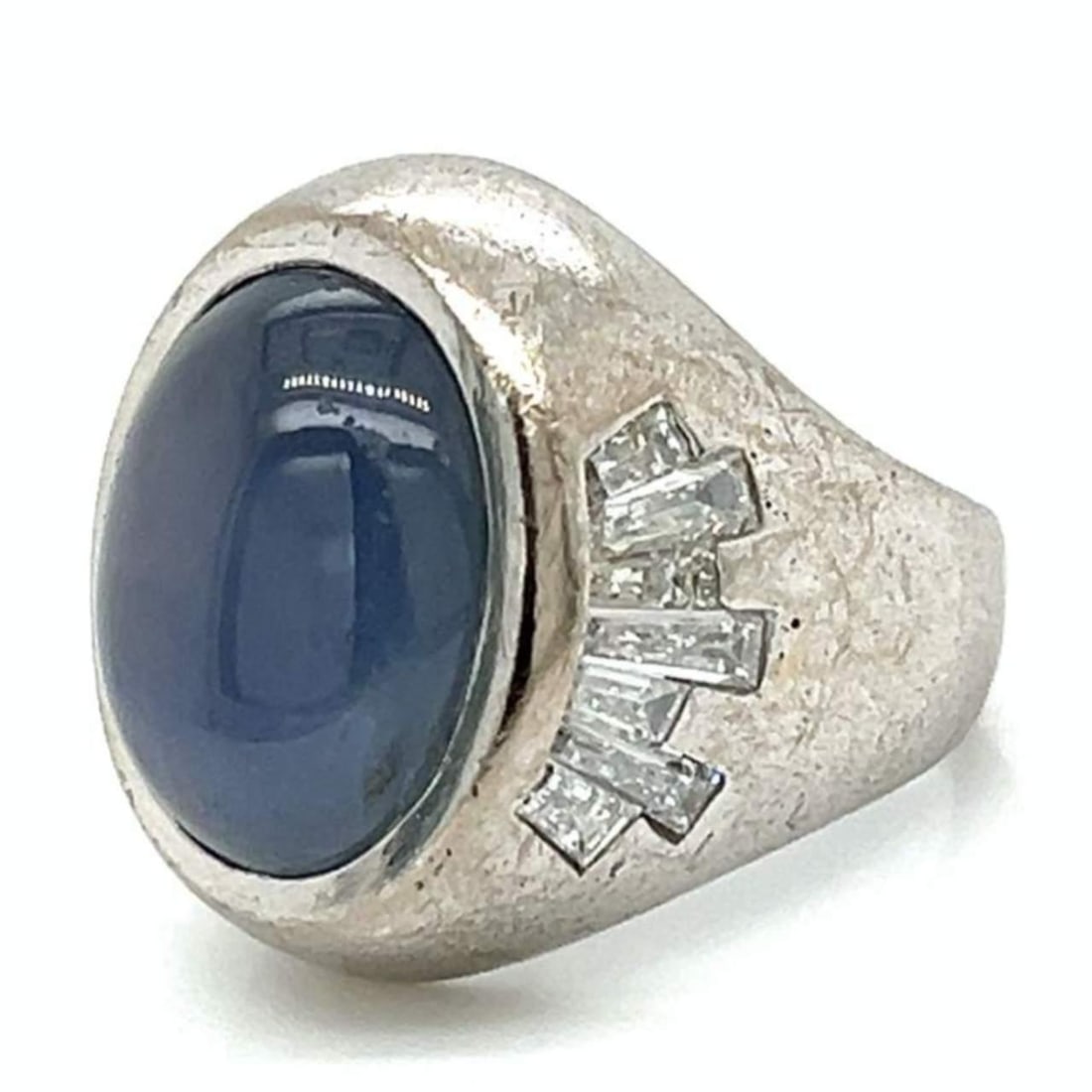 Art Deco Platinum Ring 15.00 Ct Star Sapphire 14 Diamonds: Art Deco Platinum Ring 15.00 Ct Star Sapphire 14 Diamonds This stunning Art Deco ring showcases a magnificent 15.00 Ct. star sapphire at its center, featuring a perfect star pattern that enhances its 