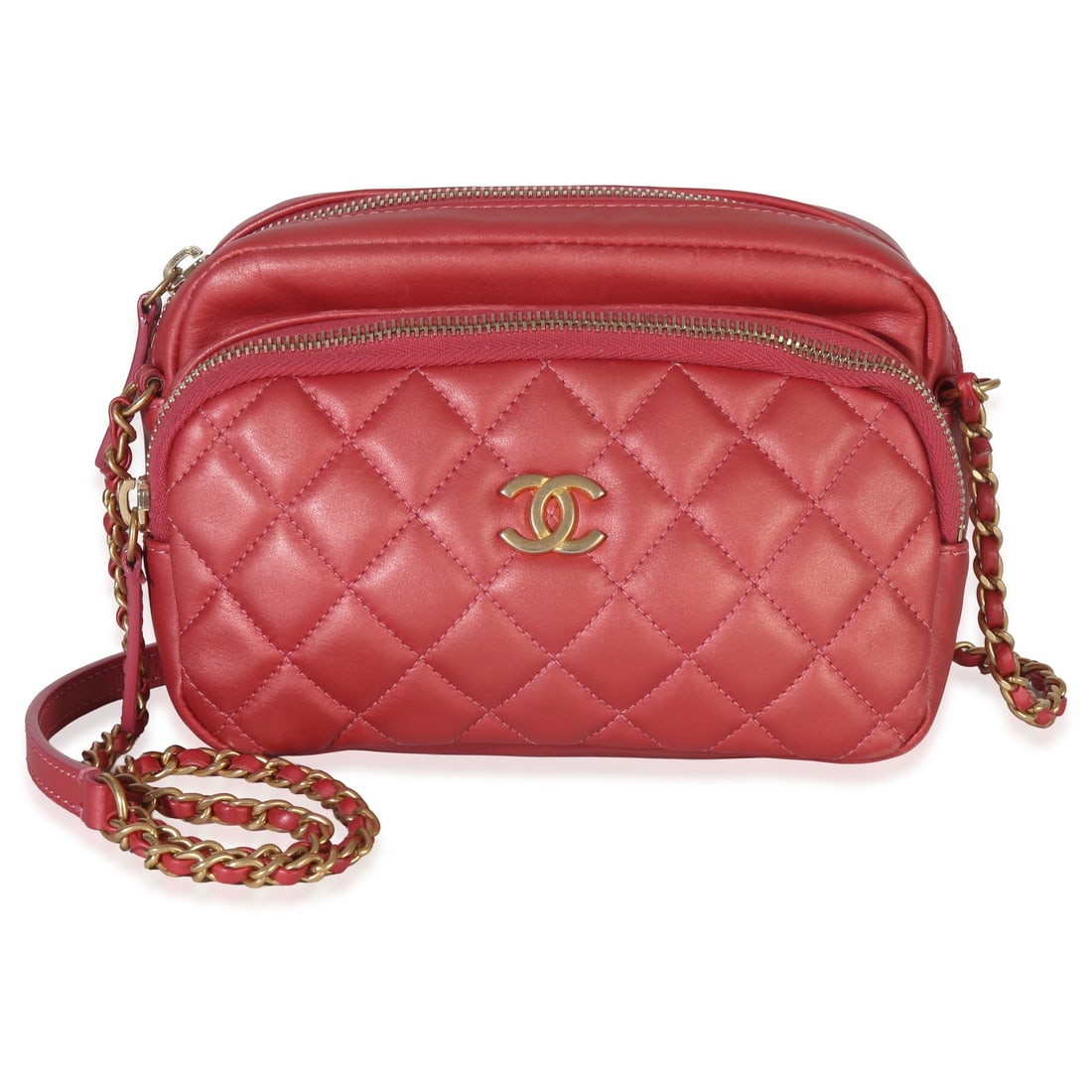 Chanel Day Trips Camera Bag Pink Iridescent Quilted Lambskin: Chanel Day Trips Camera Bag Pink Iridescent Quilted Lambskin This Chanel Day Trips Camera Bag features a pink iridescent quilted lambskin leather exterior with gold-tone hardware. The bag has a zip-to