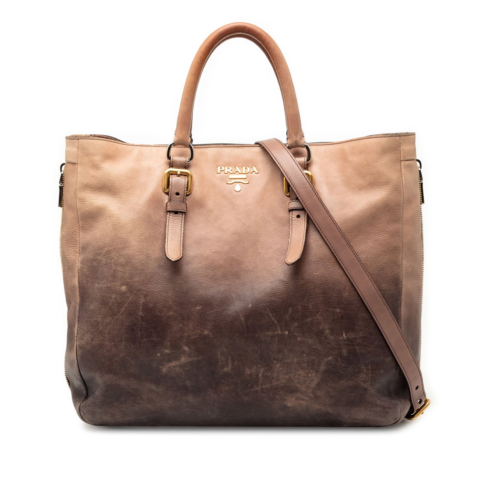 Prada brown leather convertible tote with detachable strap: Prada brown leather convertible tote with detachable strap This Prada Ombre Vitello Daino Side Zip Convertible Tote is crafted from brown leather and features side zip accents, rolled leather handles,