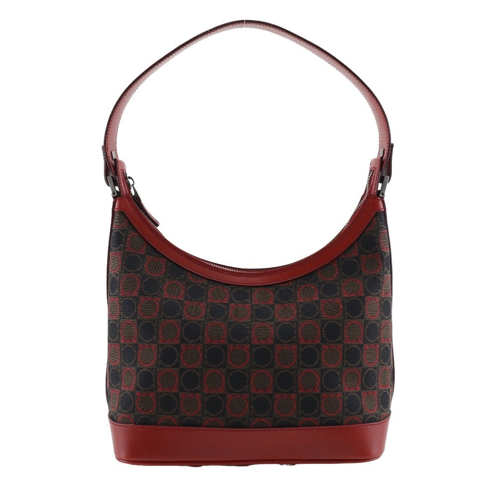 Salvatore Ferragamo Red Canvas Gancini Shoulder Bag 24cm: Salvatore Ferragamo Red Canvas Gancini Shoulder Bag 24cm This Salvatore Ferragamo Gancini shoulder bag for women features a red canvas exterior. The bag measures 24cm x 18cm x 13cm and is crafted in I