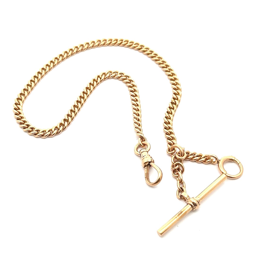 11 Inch 14k Yellow Gold Curb Cuban Watch Chain with Bar and Dog Clip: 11 Inch 14k Yellow Gold Curb Cuban Watch Chain with Bar and Dog Clip This vintage unisex watch chain features a curb Cuban link design crafted from solid 12-14k yellow gold. Measuring 11 inches in len