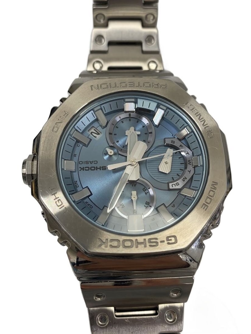 CASIO G-SHOCK GMC-B2100AD-2AJF Blue Solar Bluetooth Wristwatch: CASIO G-SHOCK GMC-B2100AD-2AJF Blue Solar Bluetooth Wristwatch This CASIO G-SHOCK GMC-B2100AD-2AJF is a men's wristwatch featuring a blue case and band. The watch is solar-powered and equipped with Bl