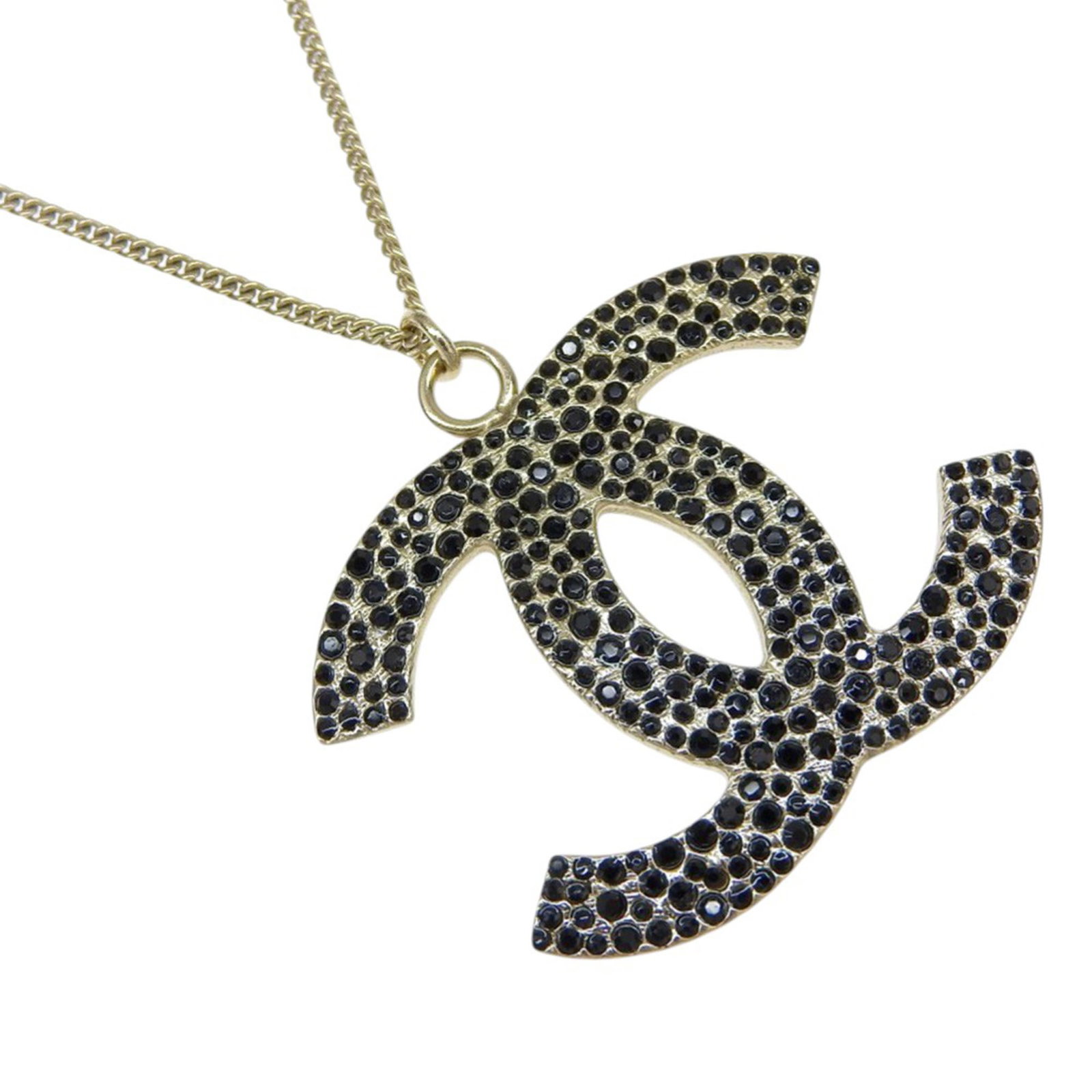 Chanel gold plated CC pendant necklace with rhinestones: Chanel gold plated CC pendant necklace with rhinestones This Chanel necklace features a gold plated metal body and a pendant adorned with rhinestone embellishments. It is secured with a lobster clasp 