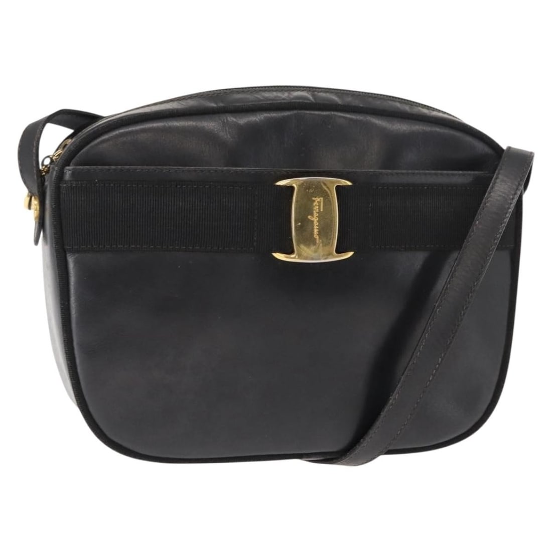 Black Leather Vala Shoulder Bag by Salvatore Ferragamo: Black Leather Vala Shoulder Bag by Salvatore Ferragamo This is a pre-owned Salvatore Ferragamo Vala shoulder bag crafted from black leather. Designed for women, the bag features a classic silhouette w