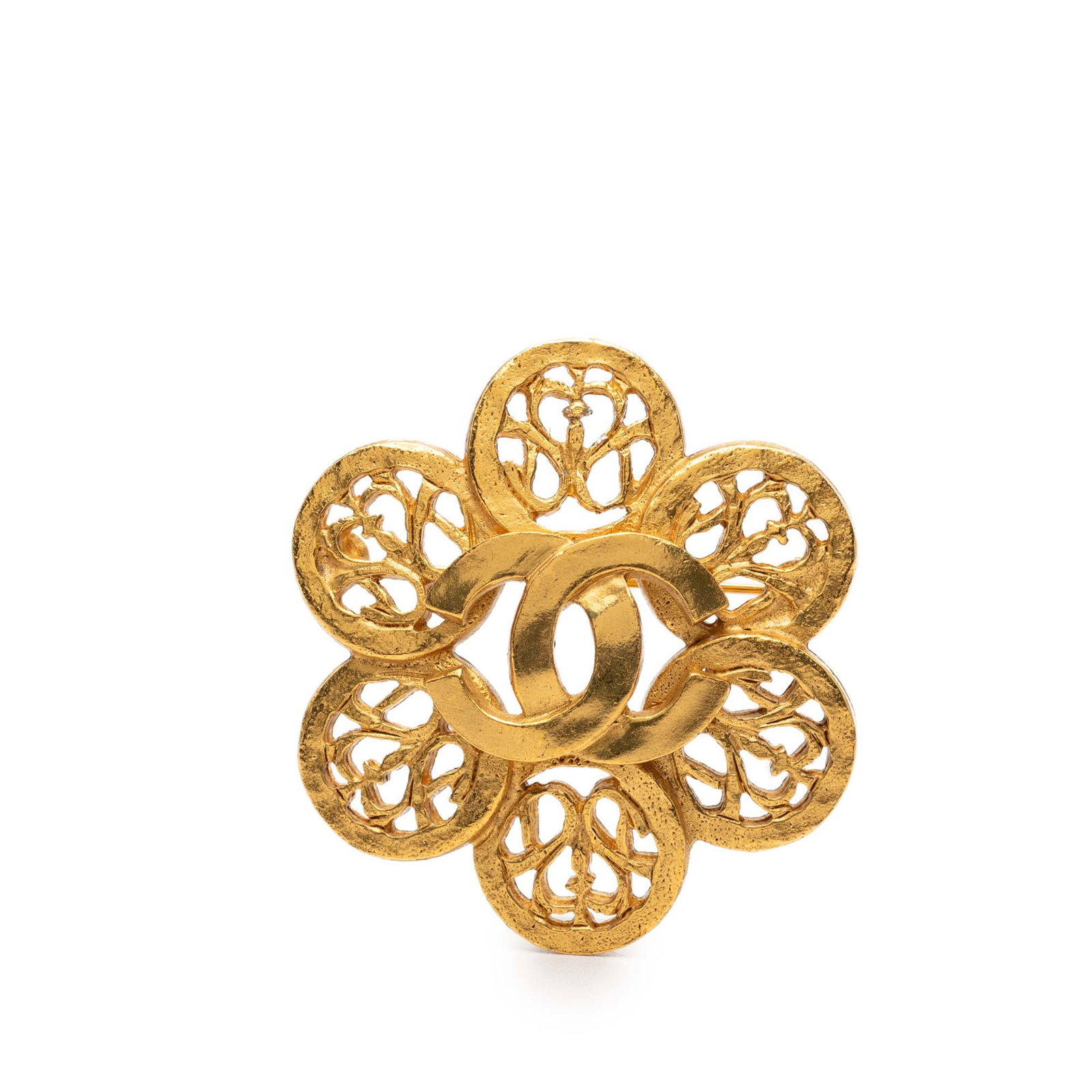 Chanel Gold Tone Flower CC Brooch: Chanel Gold Tone Flower CC Brooch This Chanel brooch features a gold tone metal construction with the iconic CC flower design and a back pin closure. The piece is categorized as costume jewelry and is