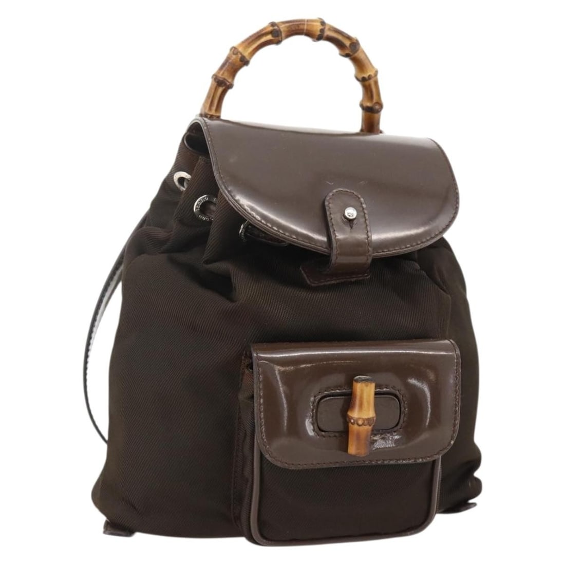 Gucci Bamboo nylon brown silver backpack 003 1998 0030: Gucci Bamboo nylon brown silver backpack 003 1998 0030 This GUCCI Bamboo Backpack features a brown and silver nylon exterior and is designed for women. The bag offers a compact, stylish profile with a