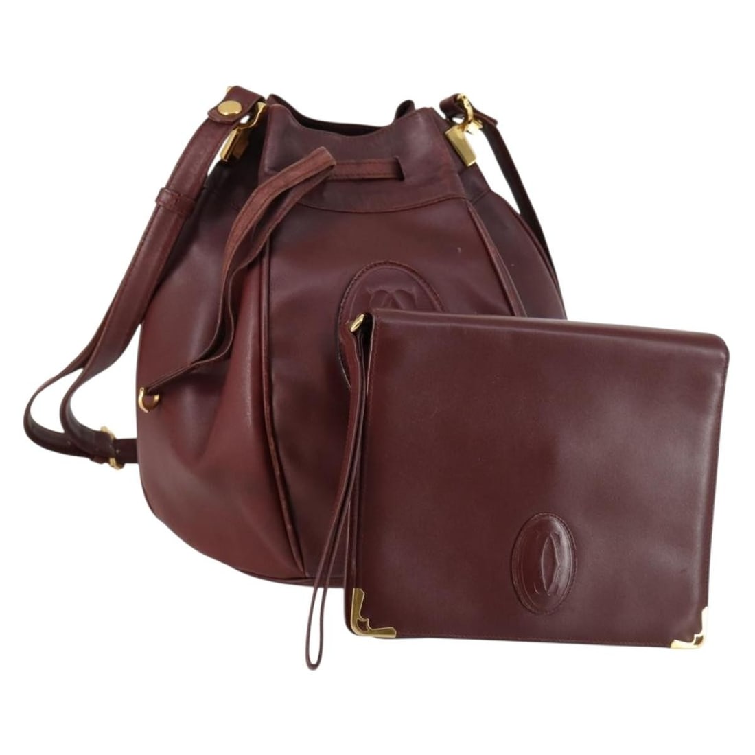 CARTIER Must Line Bordeaux Gold Leather Clutch Bag Set of 2: CARTIER Must Line Bordeaux Gold Leather Clutch Bag Set of 2 This elegant CARTIER Must Line Clutch Bag showcases a sophisticated design crafted from luxurious leather in a rich Bordeaux and gold color 