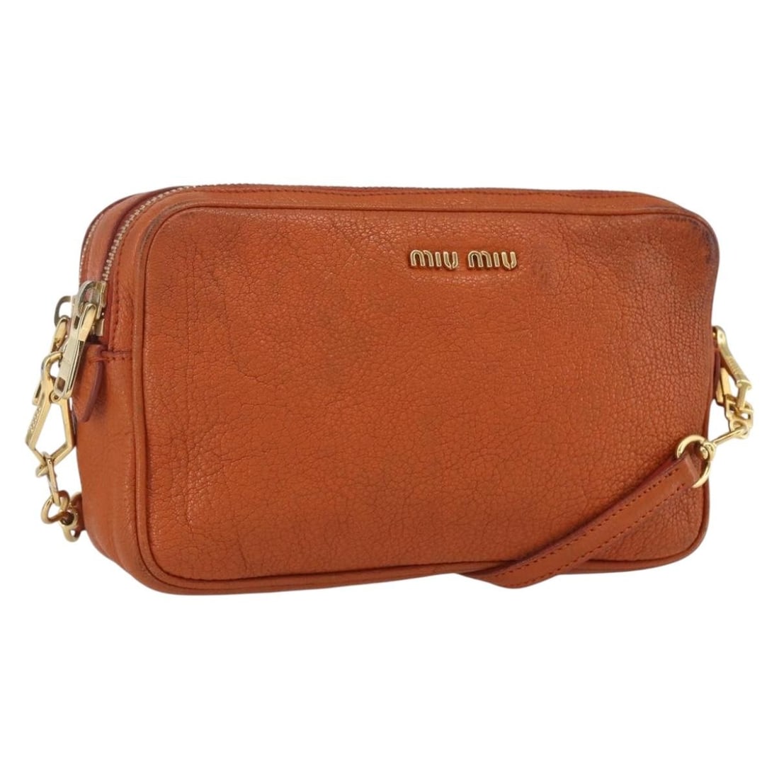 Miu Miu Orange Leather Shoulder Bag with Adjustable Strap: Miu Miu Orange Leather Shoulder Bag with Adjustable Strap This Miu Miu shoulder bag features orange leather with gold accents, offering a compact and stylish design. The bag shows signs of heavy use, 