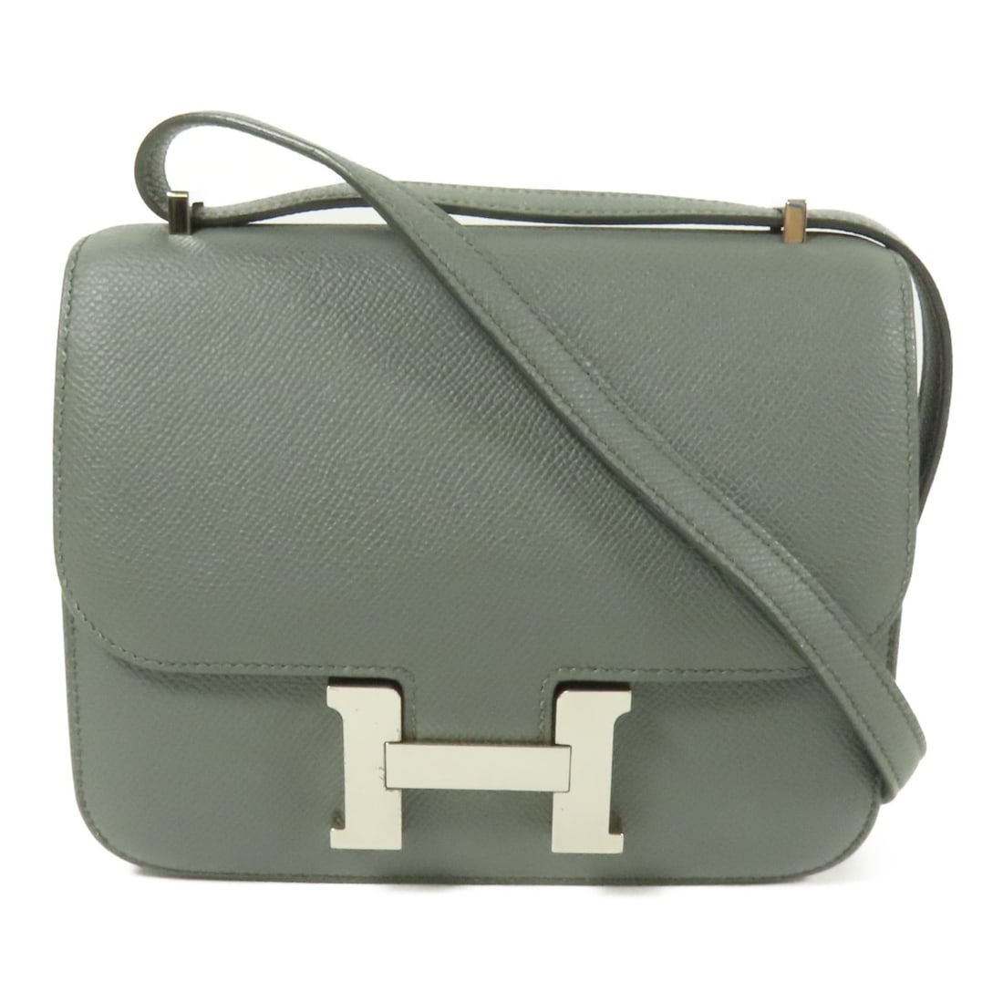 Hermes Constance Mini Epsom Leather Shoulder Bag Vert Amande PHW: Hermes Constance Mini Epsom Leather Shoulder Bag Vert Amande PHW This Hermes Constance Mini shoulder bag is crafted from Epsom calfskin leather in a sophisticated Vert Amande (green) hue. Designed for