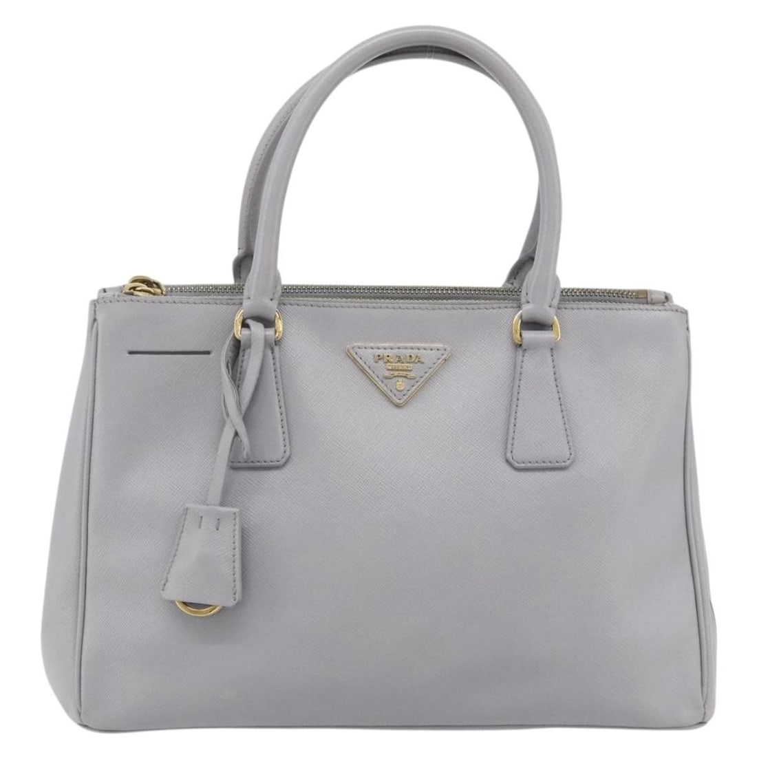 Prada Gray Saffiano Leather Gardener's Tote: Prada Gray Saffiano Leather Gardener's Tote This Prada Gardener's Tote is crafted from gray Saffiano leather and features a structured silhouette. Designed for women, the tote offers ample space and i