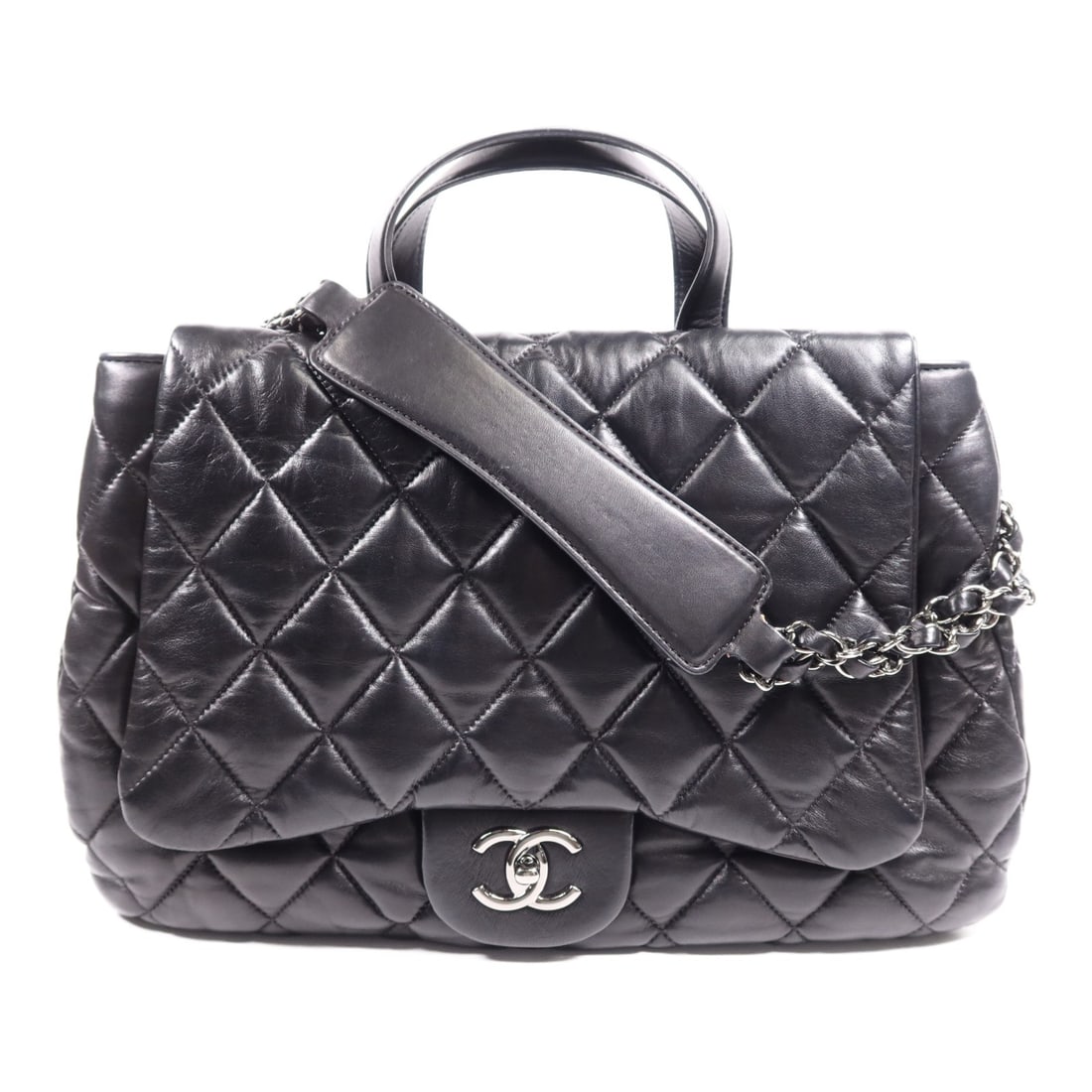 CHANEL Black Lambskin Quilted 2 Way Shoulder Bag 3 Compartments: CHANEL Black Lambskin Quilted 2 Way Shoulder Bag 3 Compartments This CHANEL 2-way shoulder bag features a classic top-quilted design with three compartments, crafted from luxurious black lambskin leat