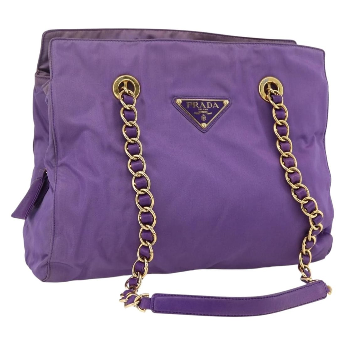 Purple Nylon PRADA Shoulder Bag with Gold Accents and Guarantee Card: Purple Nylon PRADA Shoulder Bag with Gold Accents and Guarantee Card This PRADA shoulder bag features a purple nylon exterior with gold-tone accents. Designed for women, it offers a spacious interior 