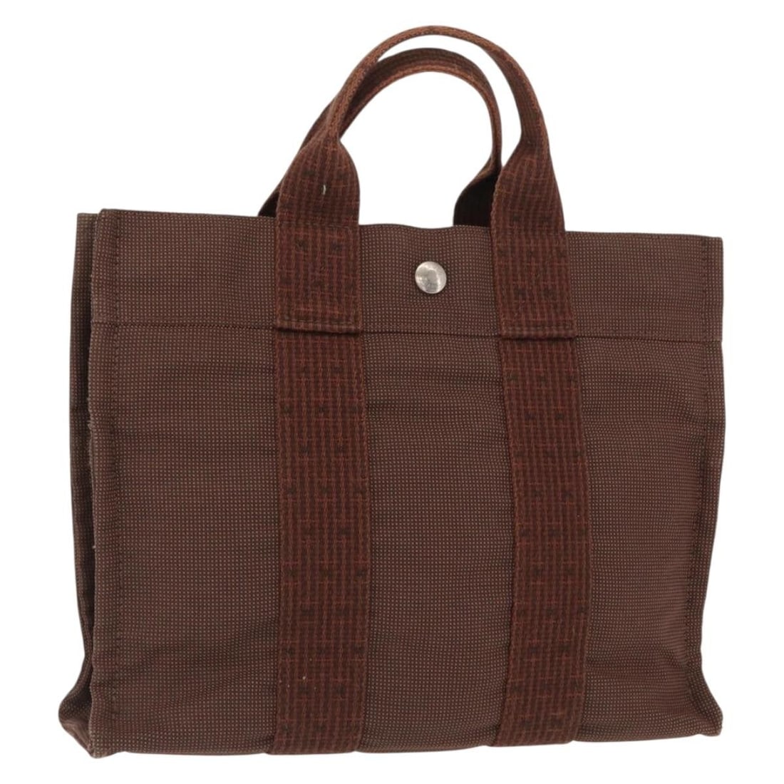 Her Line PM Canvas Tote in Brown and Silver by Hermes: Her Line PM Canvas Tote in Brown and Silver by Hermes This HERMES Her Line PM tote bag is crafted from brown and silver canvas, designed for women. The bag features a spacious interior and a practical