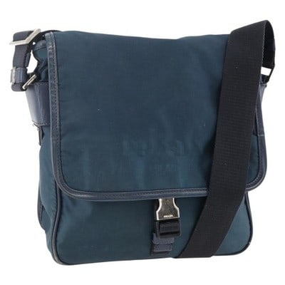 PRADA Navy Nylon Shoulder Bag Silver Tone Italy: PRADA Navy Nylon Shoulder Bag Silver Tone Italy This PRADA shoulder bag is crafted from durable navy nylon with silver-tone accents. The bag features an adjustable shoulder strap for versatile carryin