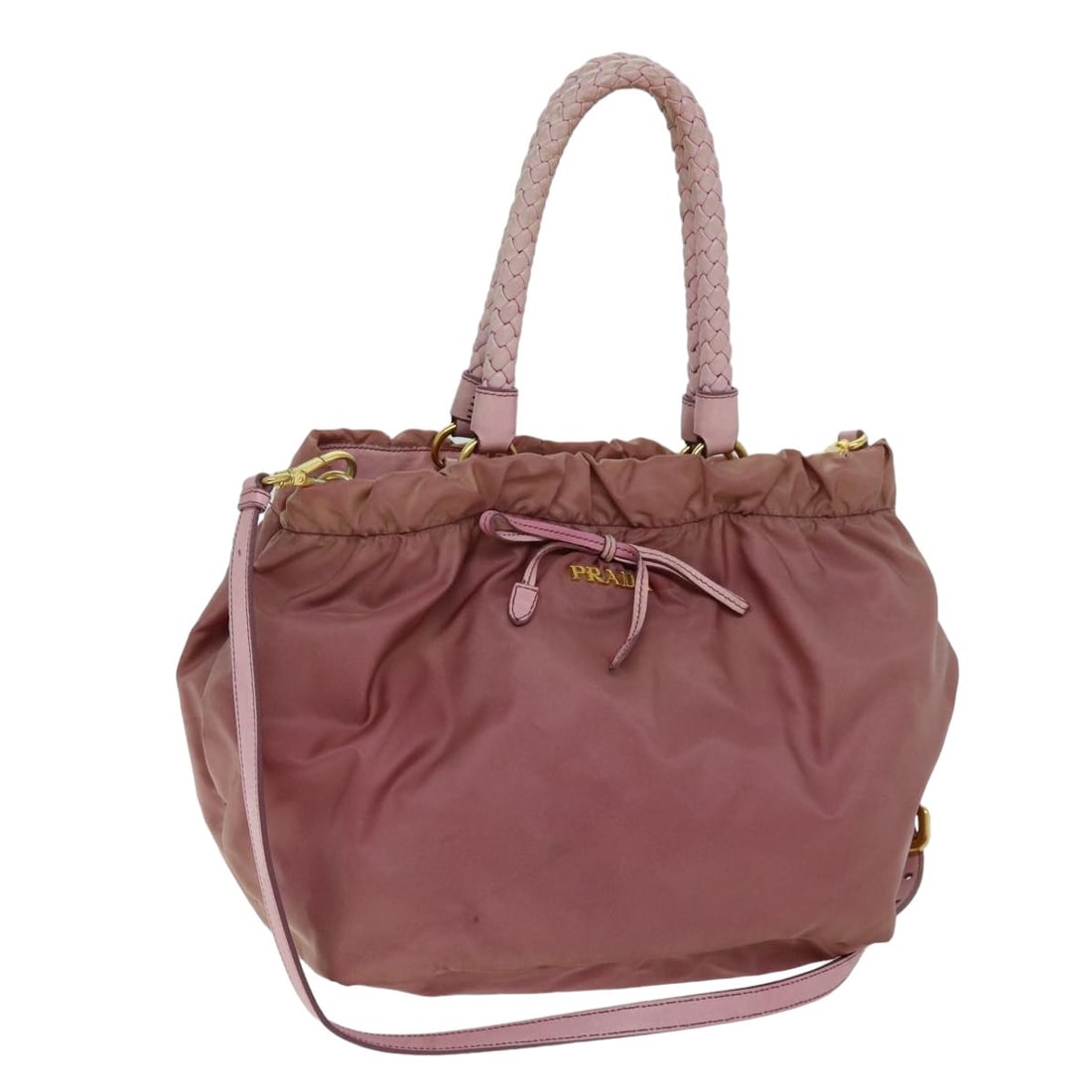 Prada Pink Nylon Shoulder Bag with Strap: Prada Pink Nylon Shoulder Bag with Strap This PRADA two-way hand bag is crafted from pink nylon and can be carried by hand or with the included shoulder strap. Designed for women, it features a spacio