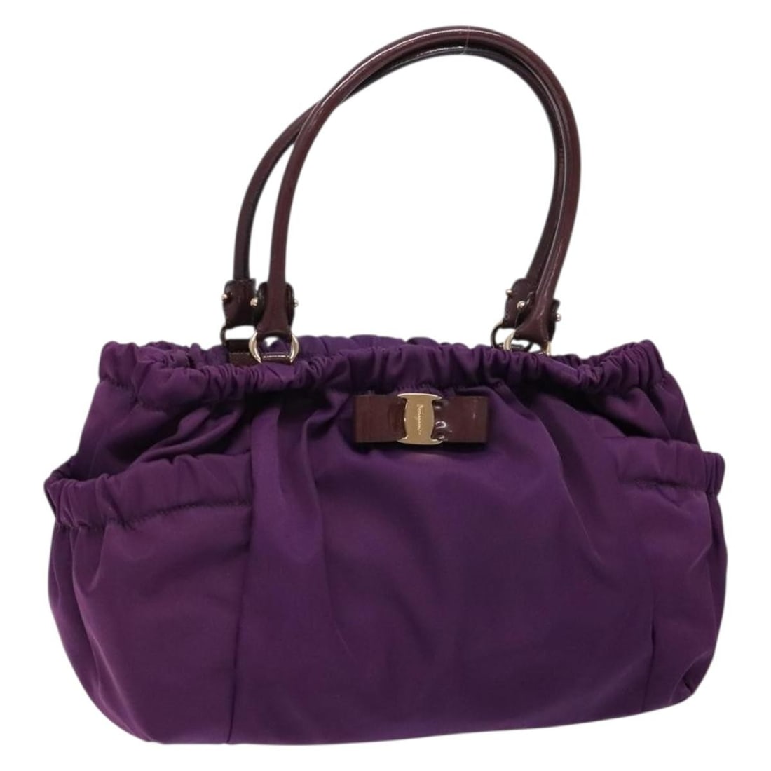 Salvatore Ferragamo Vala Purple Gold Nylon Shoulder Bag: Salvatore Ferragamo Vala Purple Gold Nylon Shoulder Bag This Salvatore Ferragamo Vala shoulder bag is crafted from nylon in a striking purple and gold color combination. Designed for women, the bag fe