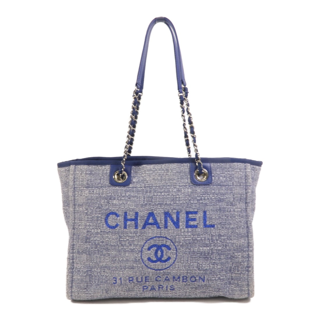 CHANEL Deauville MM Blue Canvas Tote Bag: CHANEL Deauville MM Blue Canvas Tote Bag This CHANEL Deauville MM shoulder tote bag features a classic blue canvas exterior and silver-tone hardware. Designed for women, it offers ample space with a s