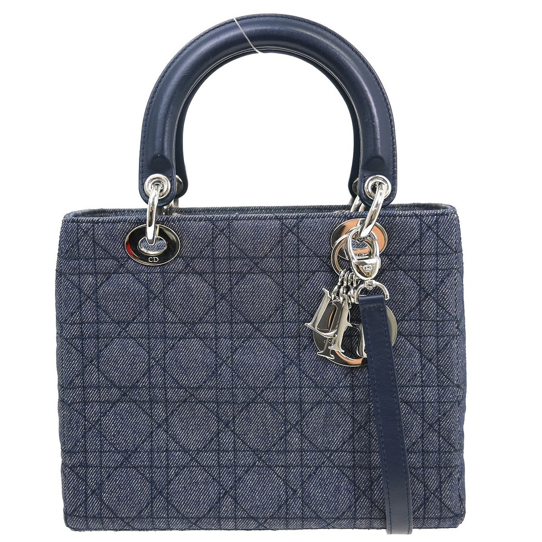 Christian Dior Lady Dior blue canvas handbag: Christian Dior Lady Dior blue canvas handbag This Christian Dior Lady Dior Bag features a classic design crafted in blue canvas, offering a stylish and versatile accessory. The bag is in very good con