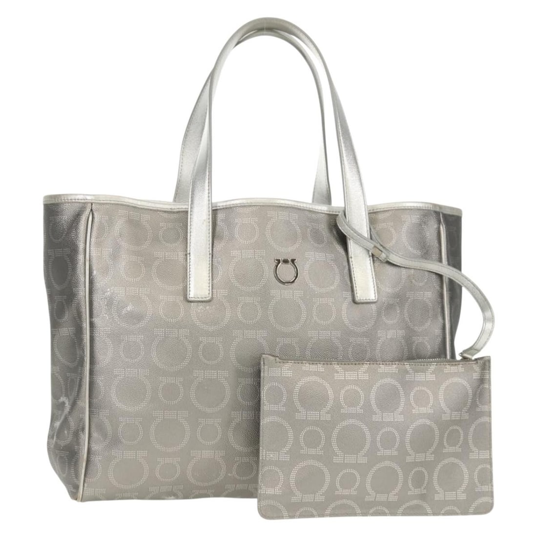 Salvatore Ferragamo Gancini Silver Leather Tote Bag with Pouch: Salvatore Ferragamo Gancini Silver Leather Tote Bag with Pouch This Salvatore Ferragamo Gancini Tote Bag is a luxurious accessory crafted from premium leather in a stunning silver finish. Made in Ital
