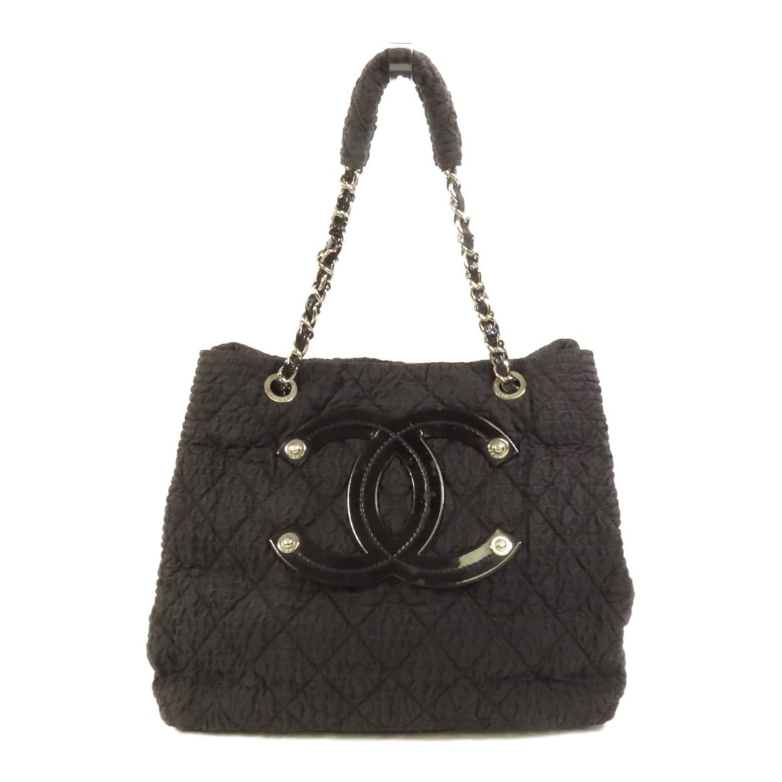 Black Nylon Tote from CHANEL CC 2009 Pre-Owned Collection: Black Nylon Tote from CHANEL CC 2009 Pre-Owned Collection This pre-owned Chanel CC tote bag from 2009 features a black nylon exterior and a spacious design, ideal for everyday use. Crafted in France, 