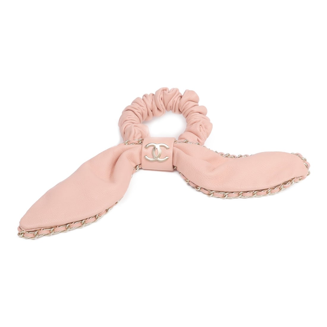 Pink Lambskin Hair Band with CC Logo by CHANEL: Pink Lambskin Hair Band with CC Logo by CHANEL This CHANEL CC hair ribbon is crafted from pink lambskin leather and designed for women. Made in France with Italian origin, it features a stylish and lu