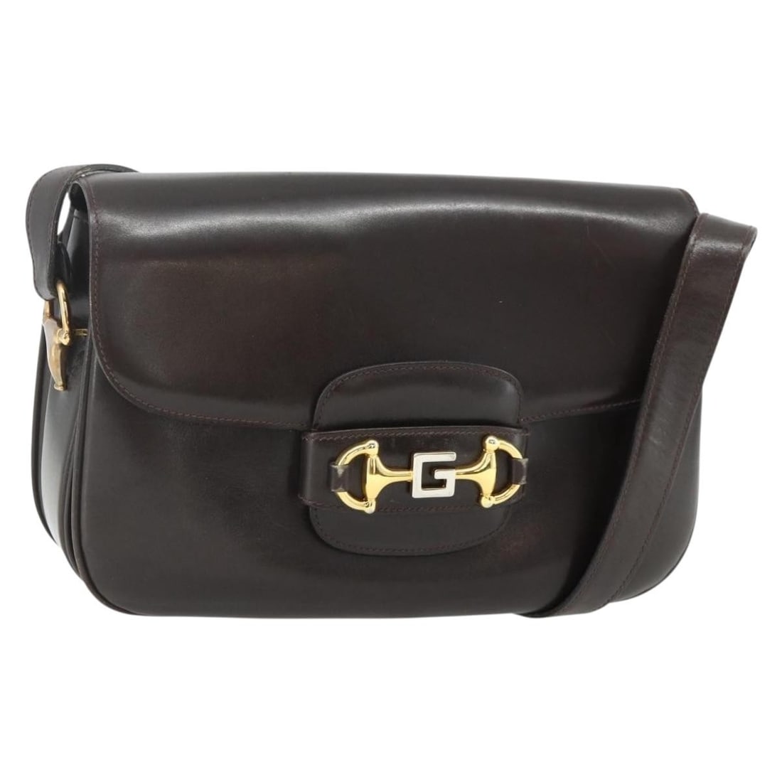 Gucci brown leather women shoulder bag Italy gold tone: Gucci brown leather women shoulder bag Italy gold tone This GUCCI shoulder bag is crafted from brown and gold leather, offering a classic and elegant look. Designed for women, it features a structured