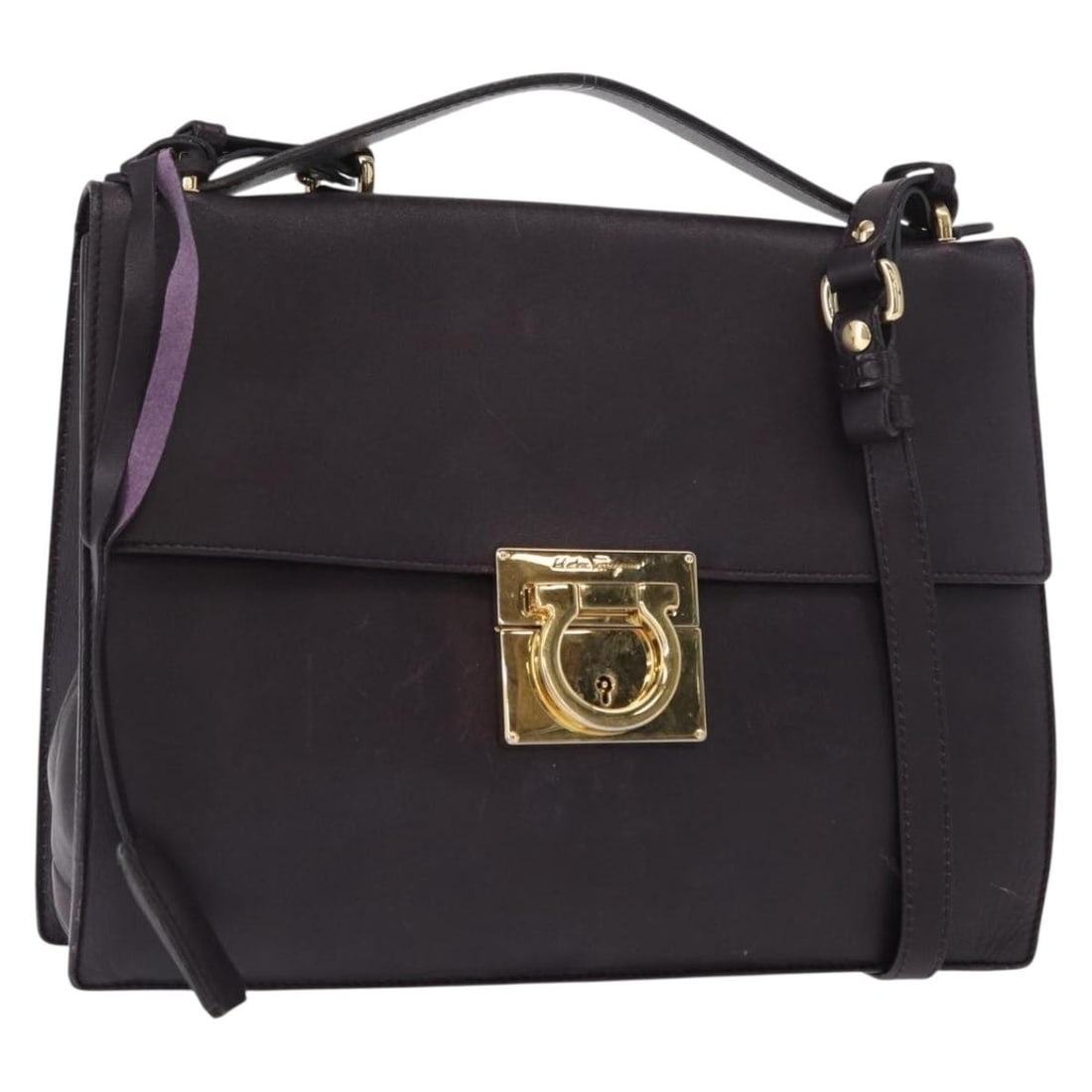 Salvatore Ferragamo Gancini Leather Shoulder Bag Purple Gold Authentic: Salvatore Ferragamo Gancini Leather Shoulder Bag Purple Gold Authentic Experience the elegance of Italian craftsmanship with the Salvatore Ferragamo Gancini Shoulder Bag. This stylish shoulder bag fea