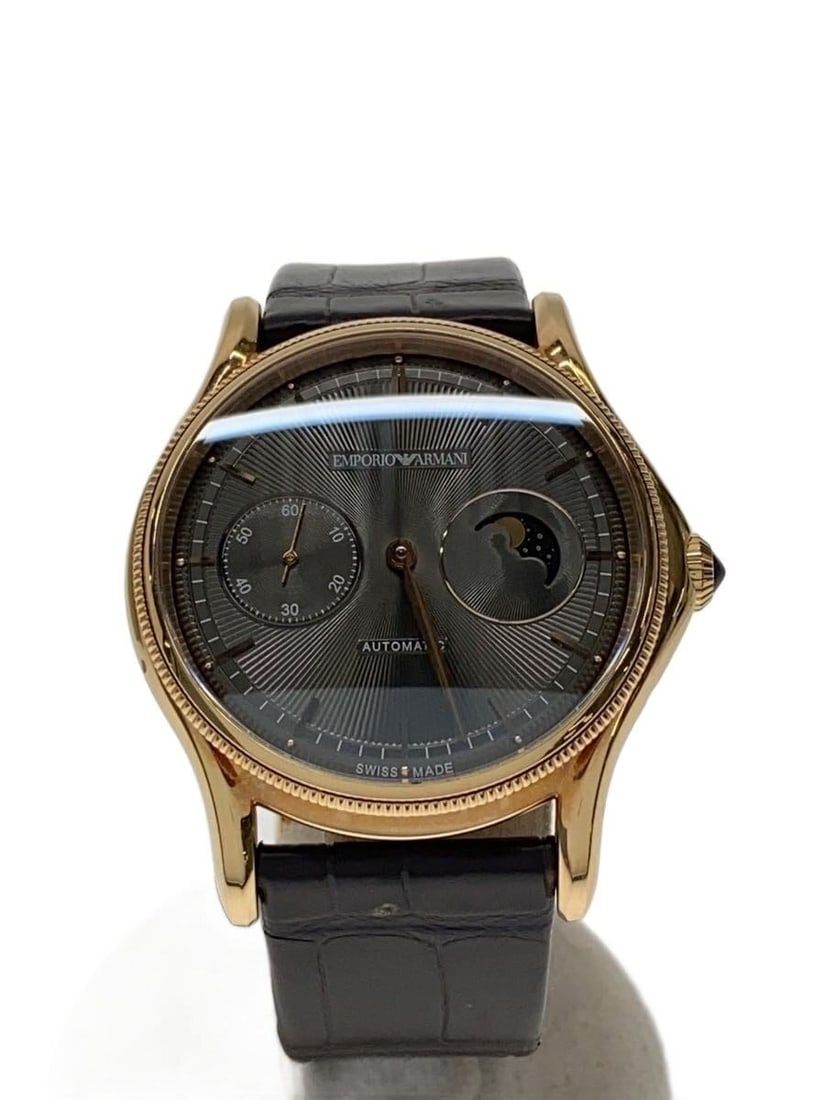 Emporio Armani Brown Leather Swiss Wristwatch ARS3610: Emporio Armani Brown Leather Swiss Wristwatch ARS3610 This Emporio Armani ARS3610 men's wristwatch features a brown leather band and a Swiss-made movement. The watch displays slight signs of wear and 