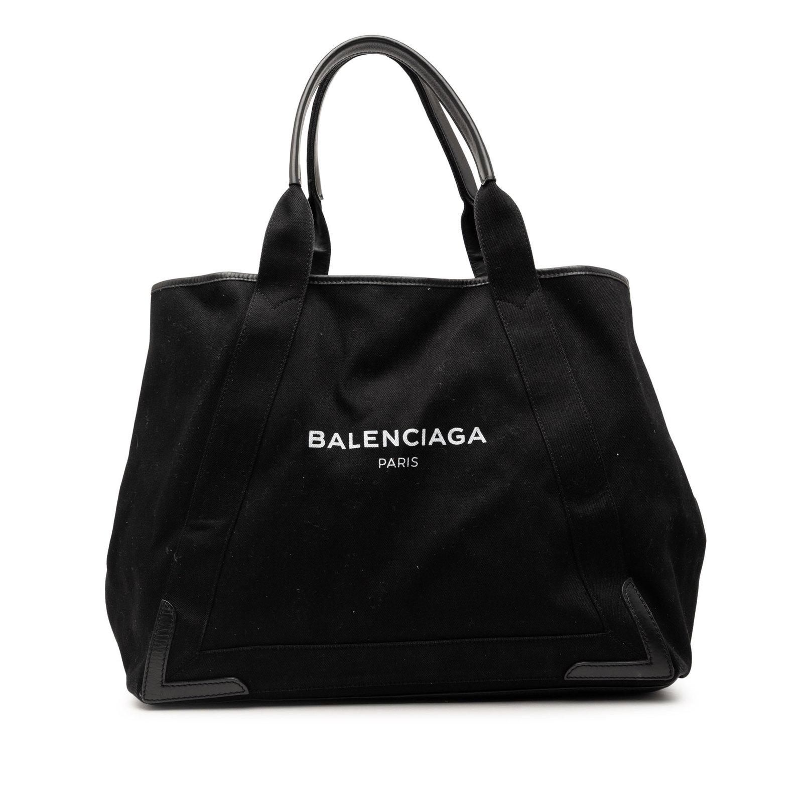 Balenciaga Cabas Denim Tote Medium Black Leather Trim: Balenciaga Cabas Denim Tote Medium Black Leather Trim This Balenciaga Denim Navy Cabas Tote M features a durable denim body accented with leather trim and flat leather handles. The bag has an open top