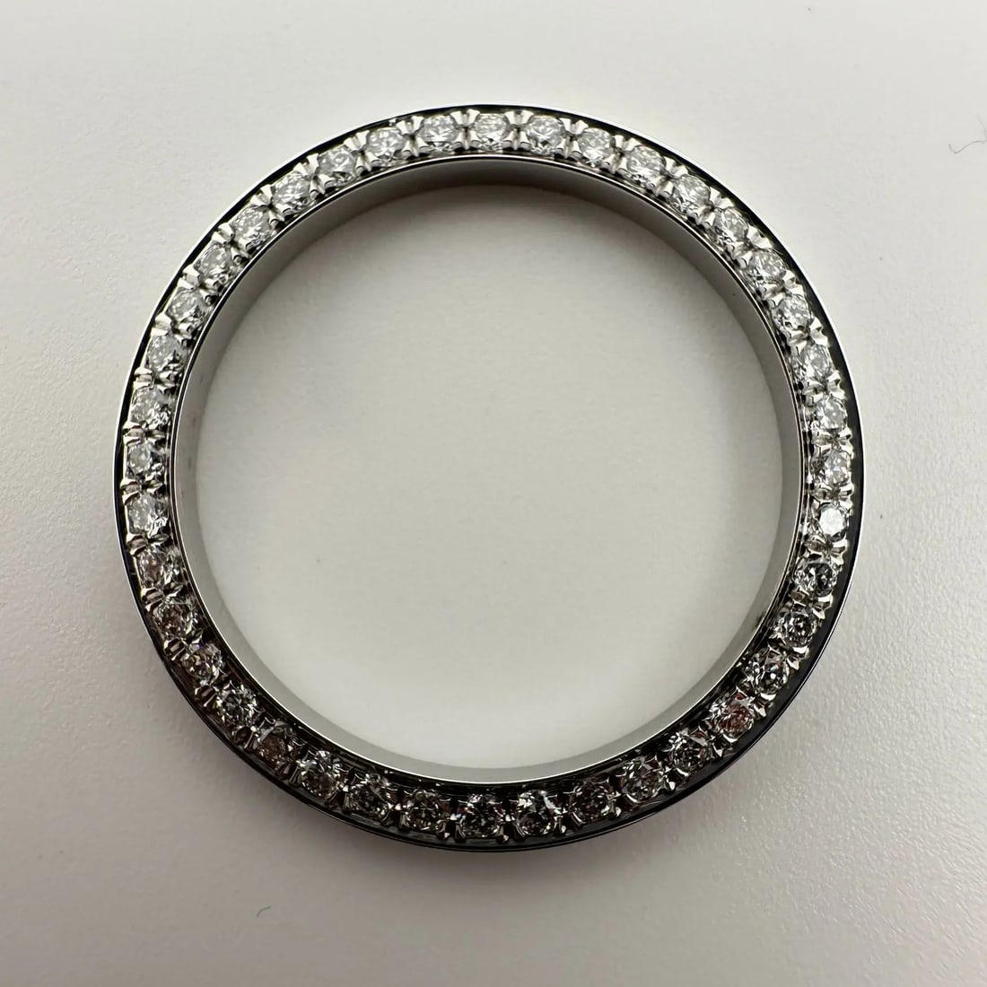 Luxury Custom Alloy Bezel with 0.77Ct Lab Diamond for Rolex Datejust 69173: Luxury Custom Alloy Bezel with 0.77Ct Lab Diamond for Rolex Datejust 69173 Elevate your Rolex Datejust 69173 with this custom alloy bezel adorned with lab-grown diamonds. This luxury bezel features a 