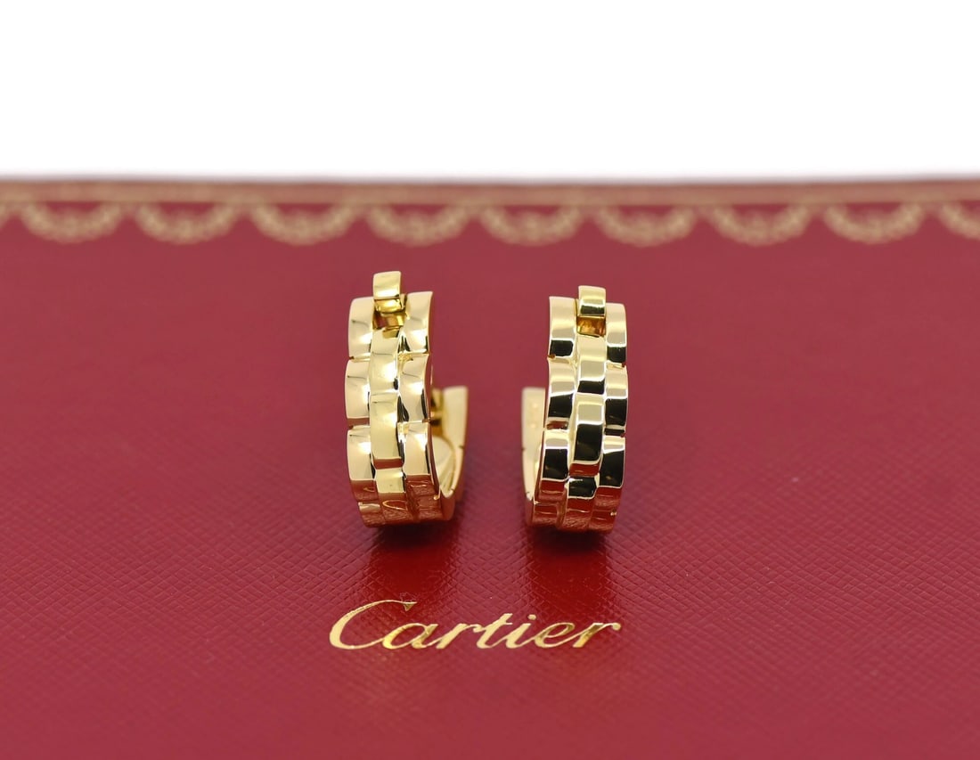 18k Yellow Gold Cufflinks by Cartier in Pouch: 18k Yellow Gold Cufflinks by Cartier in Pouch These Cartier cufflinks are crafted from 18K yellow gold and feature a classic, stone-free design. They come with an original pouch and are in pre-owned c
