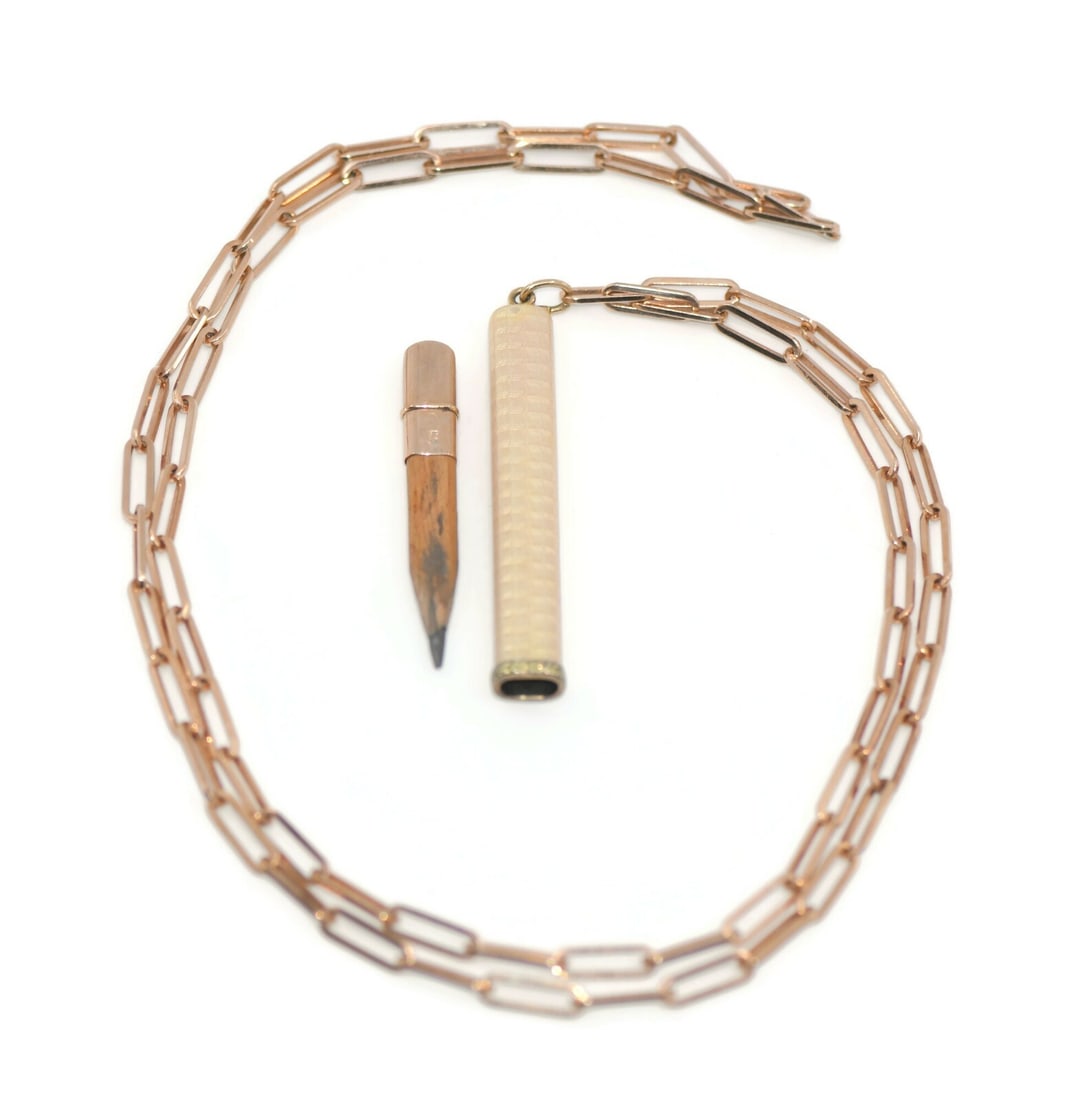 Faberge 14K Gold Multi-Tone Pendant Necklace Pencil Holder: Faberge 14K Gold Multi-Tone Pendant Necklace Pencil Holder Discover the elegance of this Faberge 14K Gold Pencil Holder Pendant Necklace. Crafted in exquisite multi-tone gold, this unique necklace fea