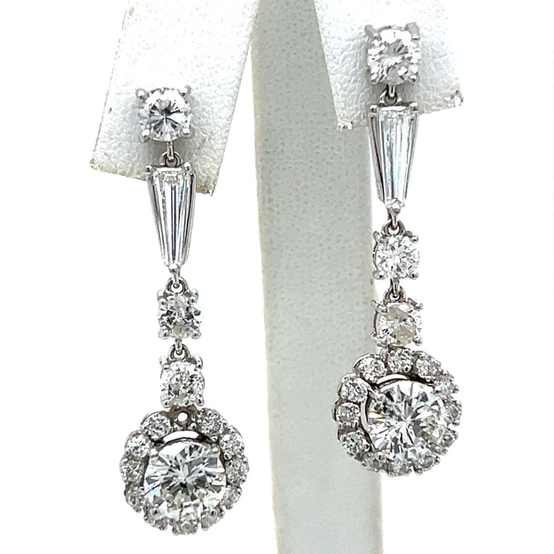 14K White Gold 6.80 Ct Diamond Earrings 1.5 inches F-H Si2-I1: 14K White Gold 6.80 Ct Diamond Earrings 1.5 inches F-H Si2-I1 Elevate your elegance with these stunning 14K White Gold Diamond Earrings. These exquisite earrings feature a total diamond weight of 6.80