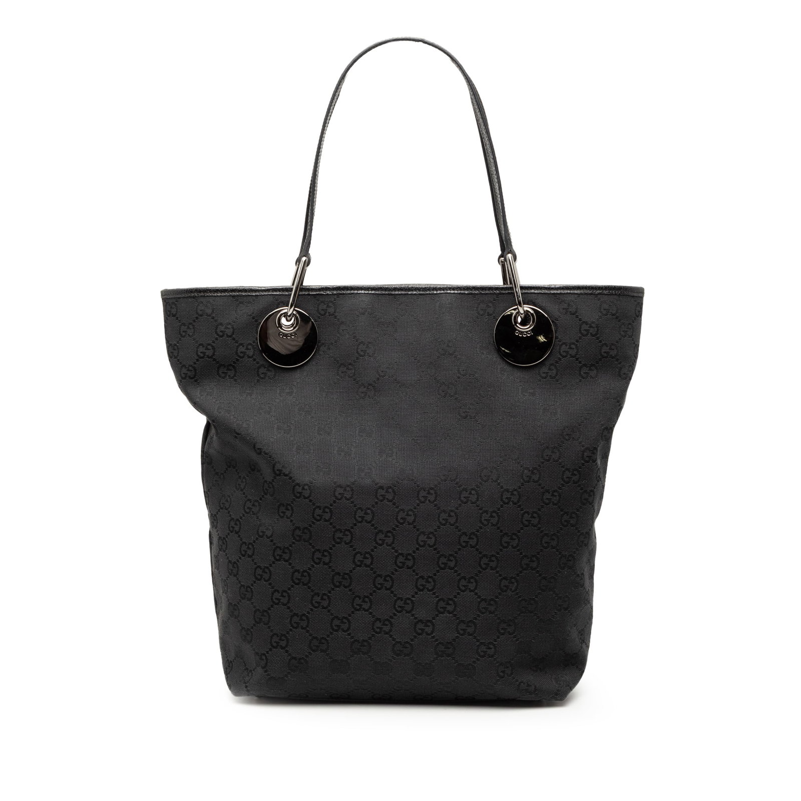 Gucci Eclipse Tote Bag in Black GG Canvas with Leather Trim: Gucci Eclipse Tote Bag in Black GG Canvas with Leather Trim This Gucci GG Canvas Eclipse Tote features a black canvas body with leather trim, flat leather straps, an open top, and interior zip and sli