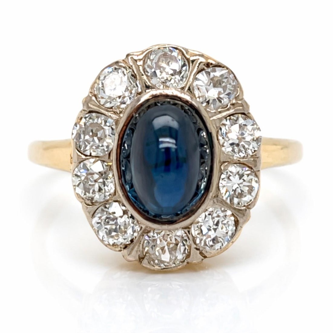 2.25 Carat Sapphire and Diamond Antique Ring in 18K Yellow Gold: 2.25 Carat Sapphire and Diamond Antique Ring in 18K Yellow Gold This antique ring features a 2.25 carat sapphire set in 18K yellow gold, accented by ten old mine cut diamonds totaling approximately 0.