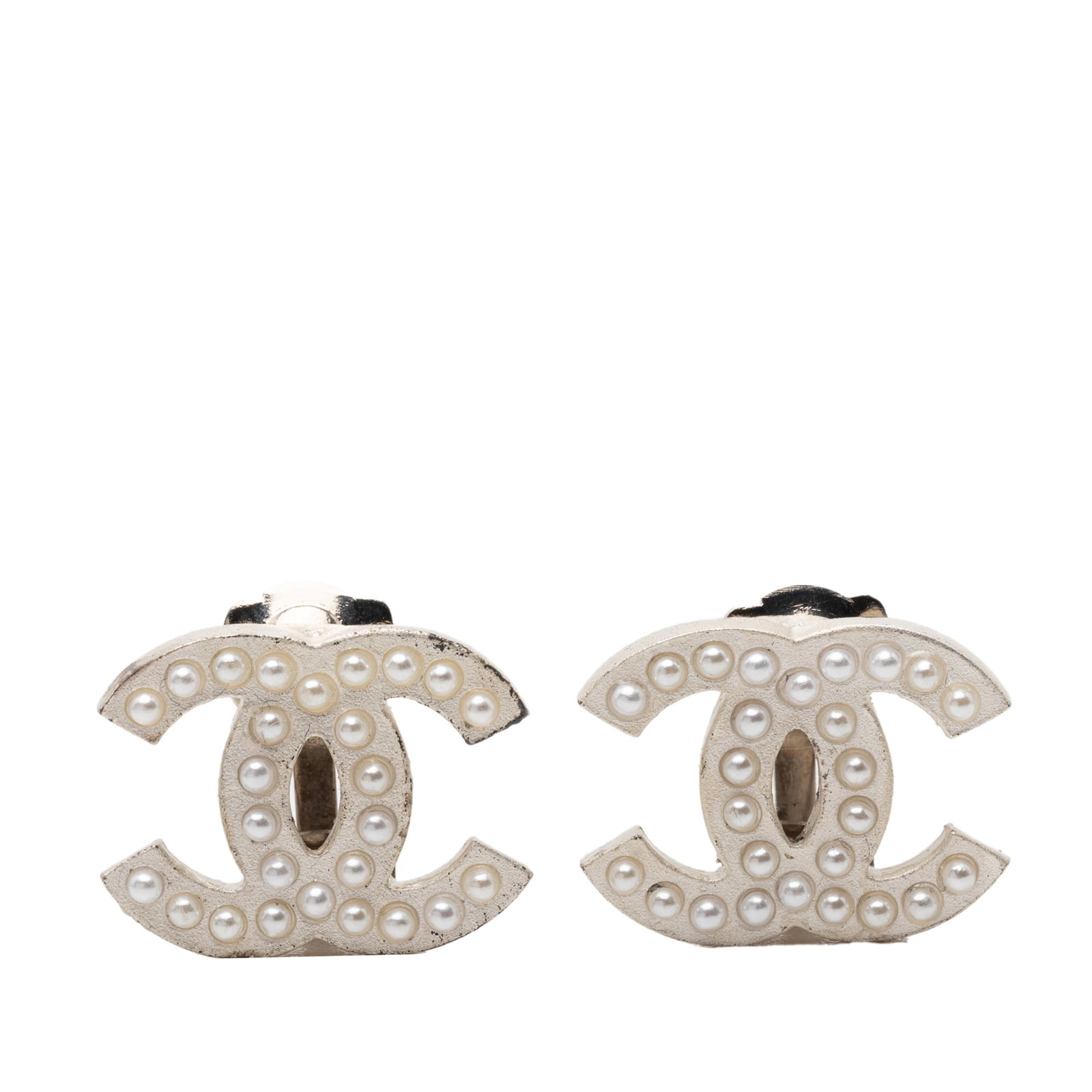 Chanel CC pearl clip on earrings gold tone plated: Chanel CC pearl clip on earrings gold tone plated These Chanel costume earrings feature gold tone plated metal bodies adorned with pearl embellishments and secure clip-on closures. Made in France, the