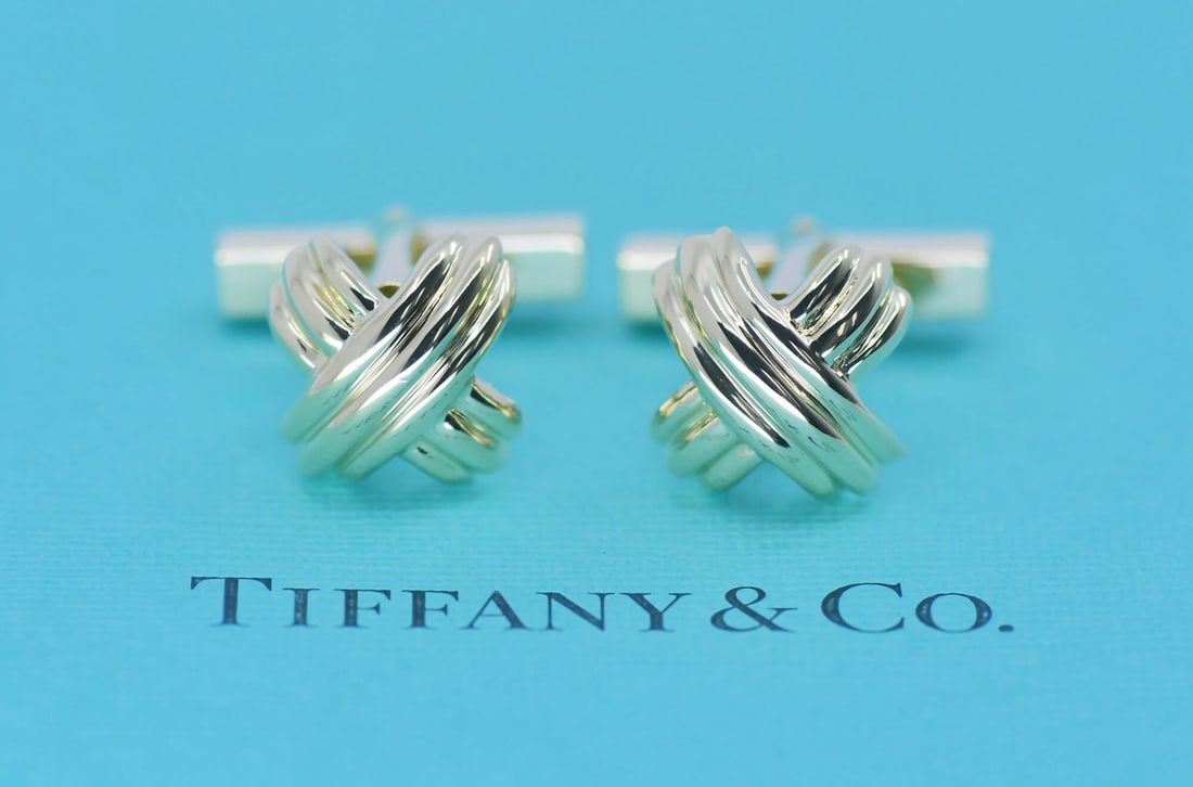 18K Yellow Gold Cufflinks by Tiffany & Co with Pouch: 18K Yellow Gold Cufflinks by Tiffany & Co with Pouch These cufflinks by Tiffany & Co. are crafted from 18K yellow gold and designed for men. Made in Italy, they feature a classic style and come with a