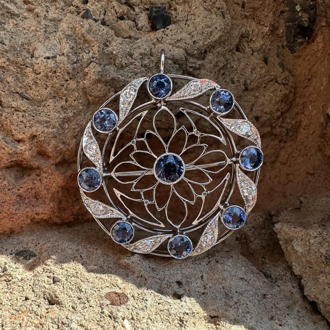 Art Deco Platinum Yogo Gulch Sapphire Diamond Brooch Pendant GIA: Art Deco Platinum Yogo Gulch Sapphire Diamond Brooch Pendant GIA This antique Art Deco brooch pendant features a captivating design crafted from solid platinum with a 14k white gold pin. The centerpie