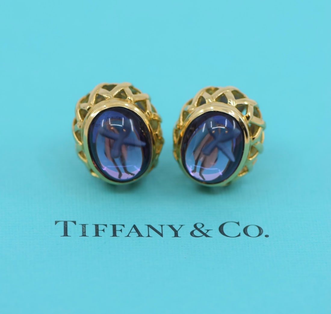 Tiffany & Co Paloma Picasso Amethyst 18K Yellow Gold Stud Earrings: Tiffany & Co Paloma Picasso Amethyst 18K Yellow Gold Stud Earrings Enhance your jewelry collection with these exquisite earrings by Tiffany & Co, designed by Paloma Picasso. These stunning stud