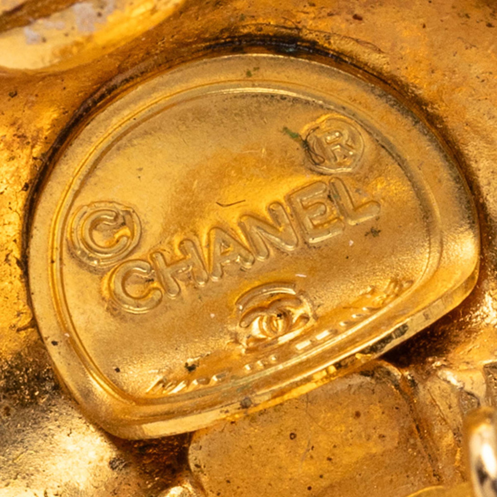 Chanel quilted diamond shape gold plated clip earrings: Chanel quilted diamond shape gold plated clip earrings These Chanel clip-on earrings feature a gold plated metal body with a distinctive quilted diamond shape design. Made in France, they are classifi