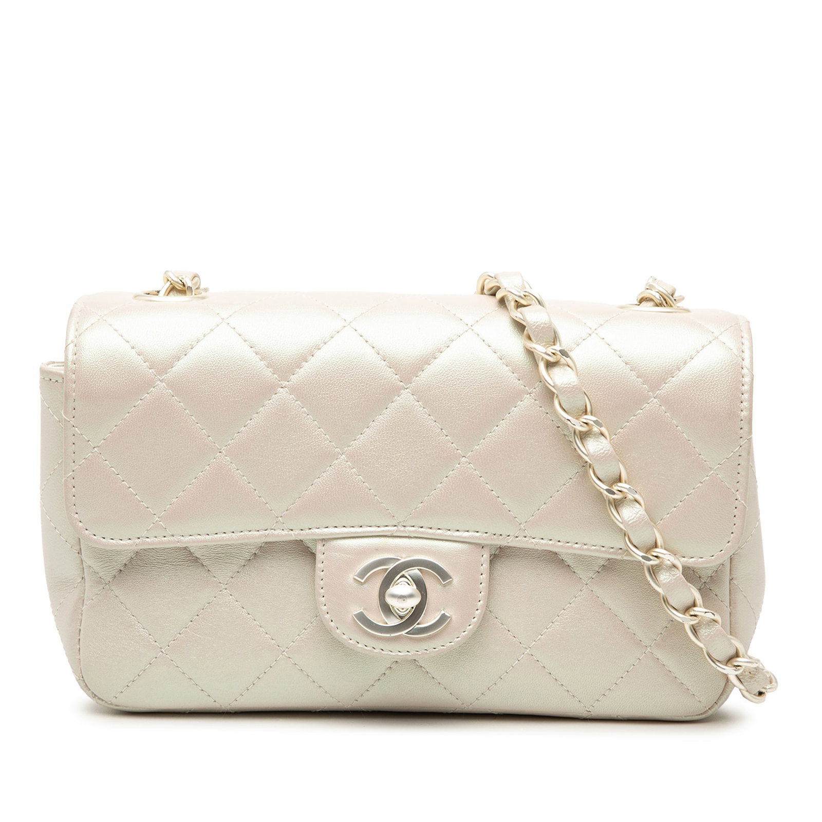 Chanel Mini Rectangular Iridescent Lambskin Flap Crossbody Bag: Chanel Mini Rectangular Iridescent Lambskin Flap Crossbody Bag This Chanel Mini Rectangular Classic Iridescent Lambskin Single Flap bag showcases a quilted lambskin leather exterior in white with an