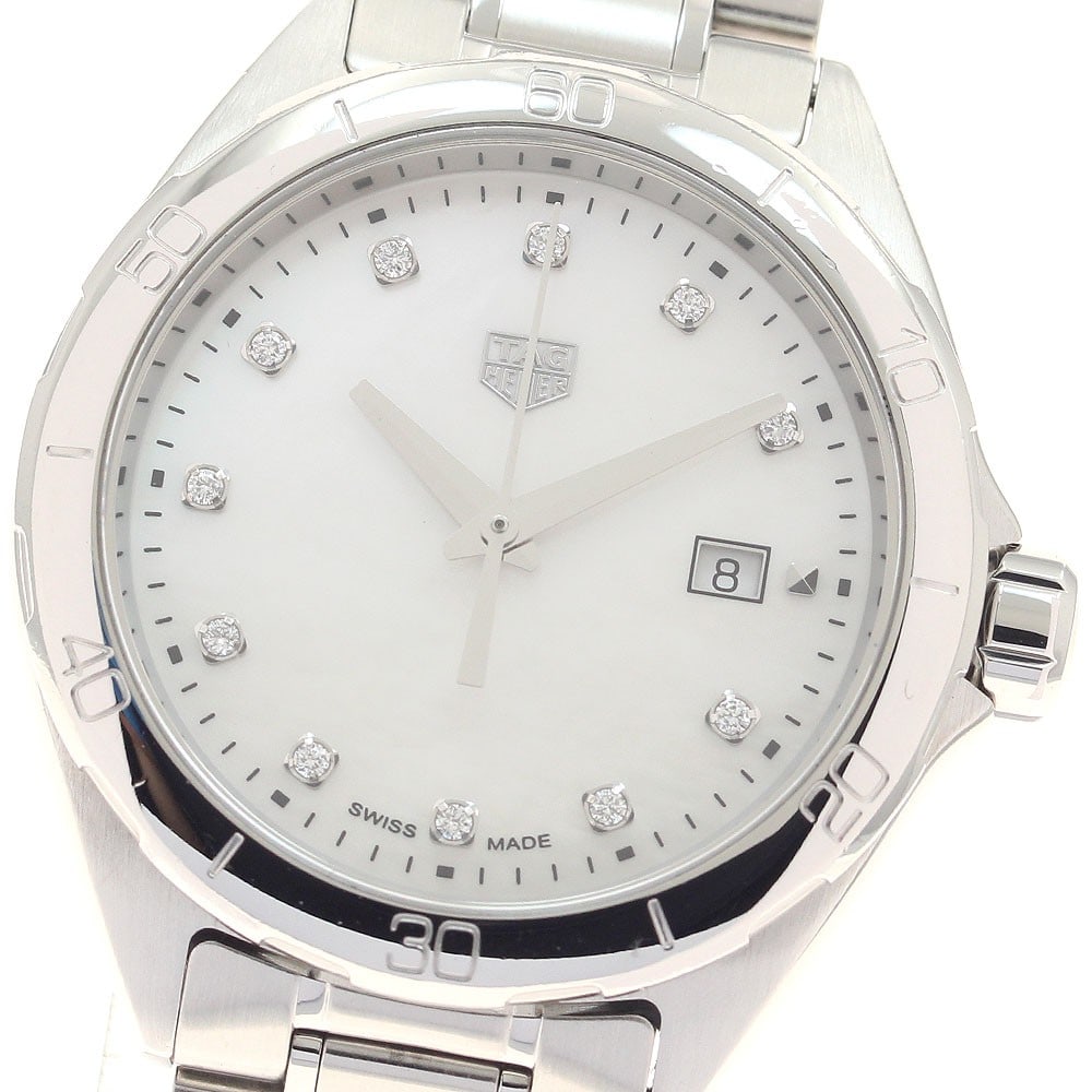 TAG Heuer Formula 1 quartz ladies date watch 11 diamonds: TAG Heuer Formula 1 quartz ladies date watch 11 diamonds This TAG Heuer Formula 1 women's wristwatch features a white mother-of-pearl dial adorned with 11 diamond hour markers. The watch is crafted fr