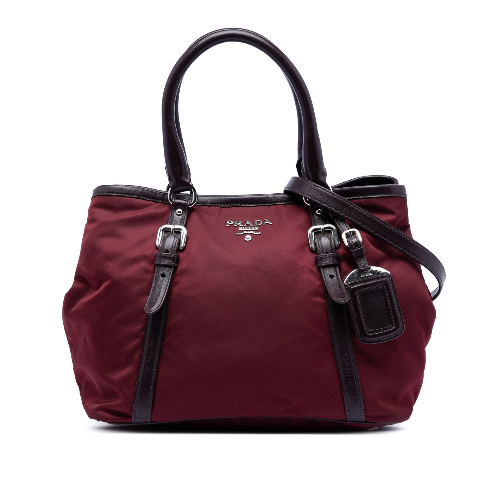 Prada red nylon leather trim satchel Vitello Daino: Prada red nylon leather trim satchel Vitello Daino This Prada Vitello Daino Trimmed Tessuto Satchel features a durable red nylon body accented with leather trim. It is designed with rolled leather han