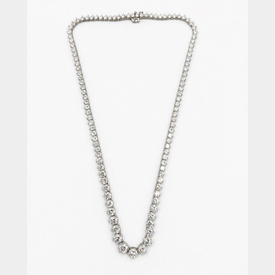 Graduated Diamond 14K White Gold Necklace 17 Inch Center Stone: Graduated Diamond 14K White Gold Necklace 17 Inch Center Stone This elegant necklace is crafted from 14K white gold and features a graduated design set with 107 diamonds totaling approximately 21.90 c