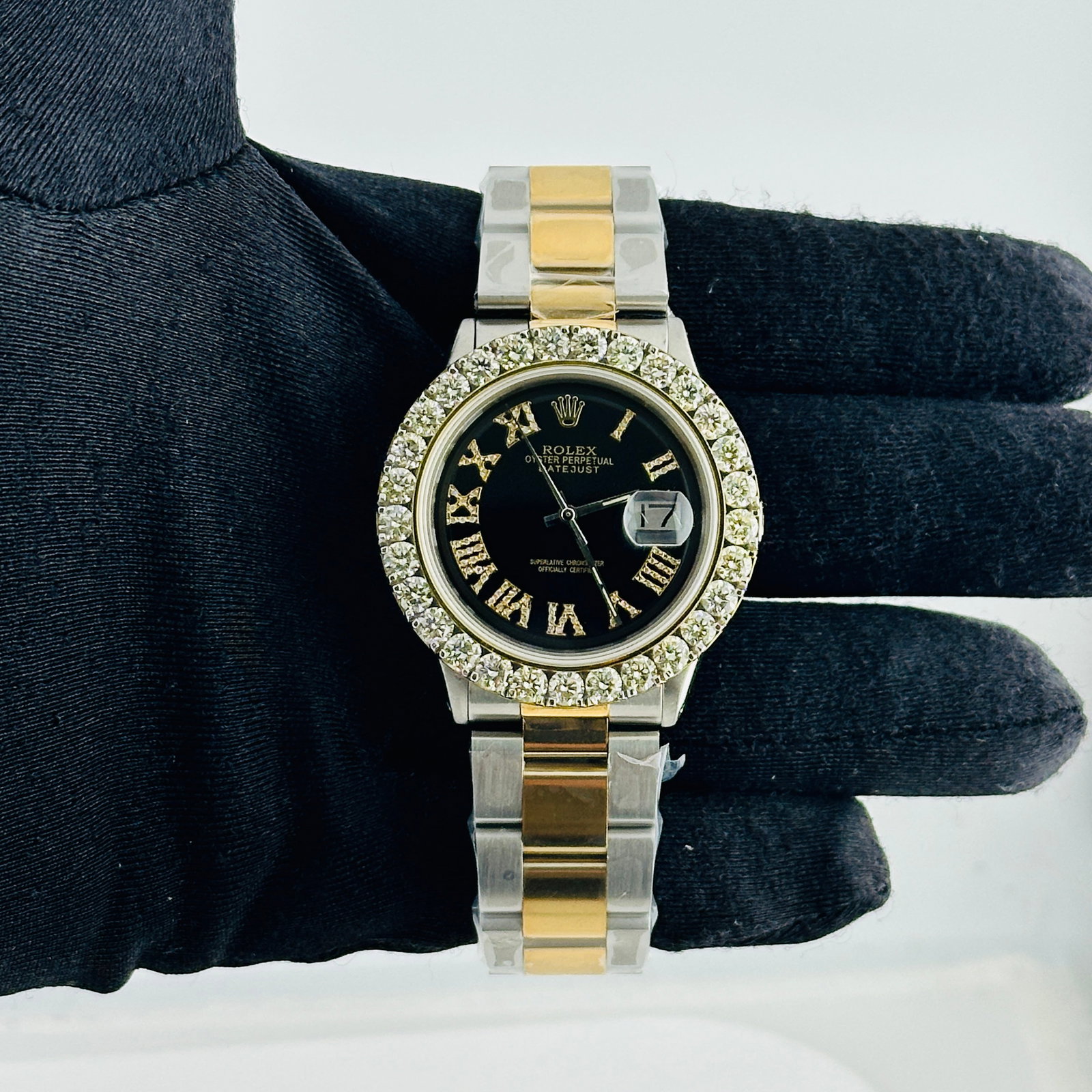 Rolex Datejust aftermarket black Roman diamond dial Oyster bracelet Ref 1601: Rolex Datejust aftermarket black Roman diamond dial Oyster bracelet Ref 1601 This men's Rolex Datejust features an aftermarket black dial with Roman numerals and diamond hour markers. The watch is equ
