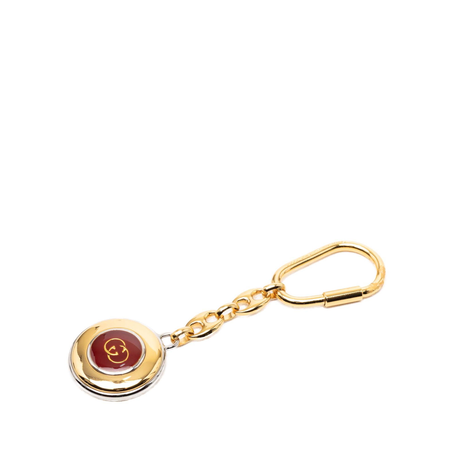 Gucci gold tone resin charm key chain: Gucci gold tone resin charm key chain This Gucci key chain features a gold-tone metal body with a resin logo charm and a secure clasp closure. Crafted in Italy, it is designed as a stylish accessory a